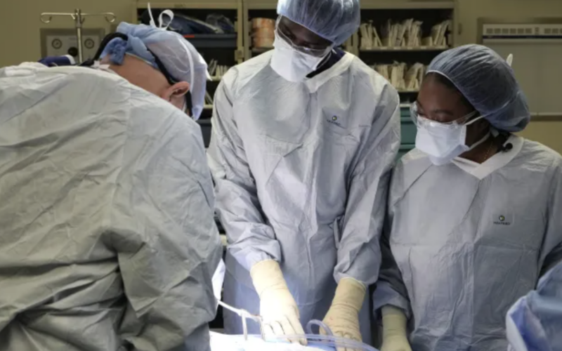 Two Black medical students in an operating room